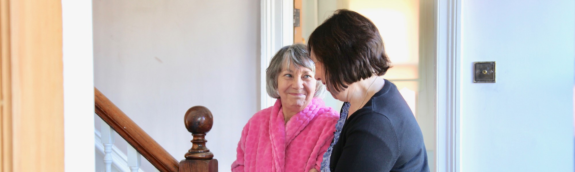 Female caregiver helping female client