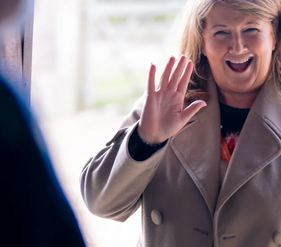 Carer being greeted by their Client