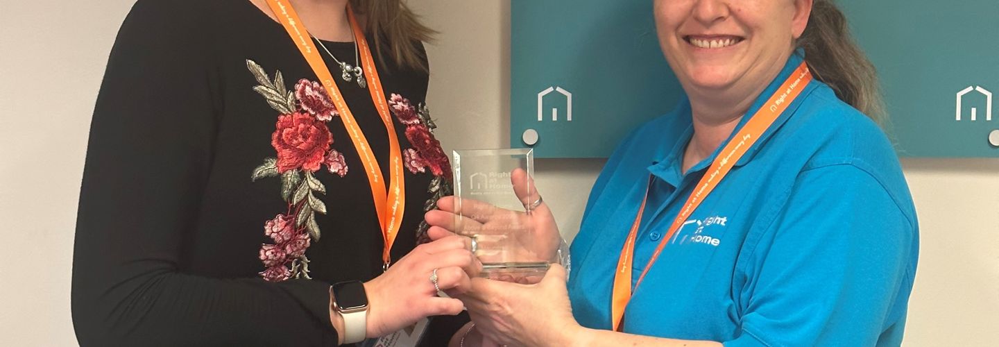 A CareGiver receiving an award
