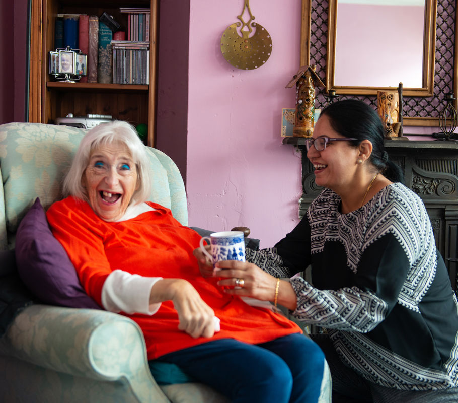 Client and CareGiver talking and smiling 