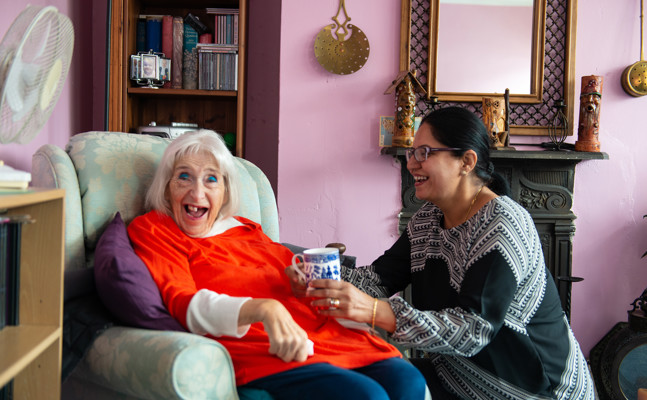 Client and CareGiver talking and smiling