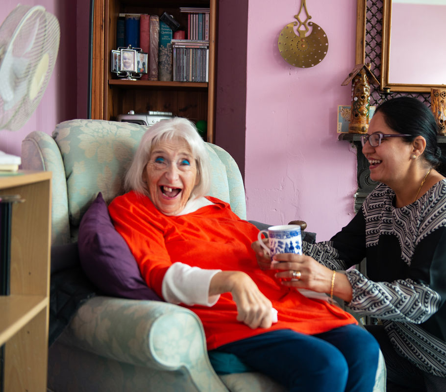 Client and CareGiver talking and smiling