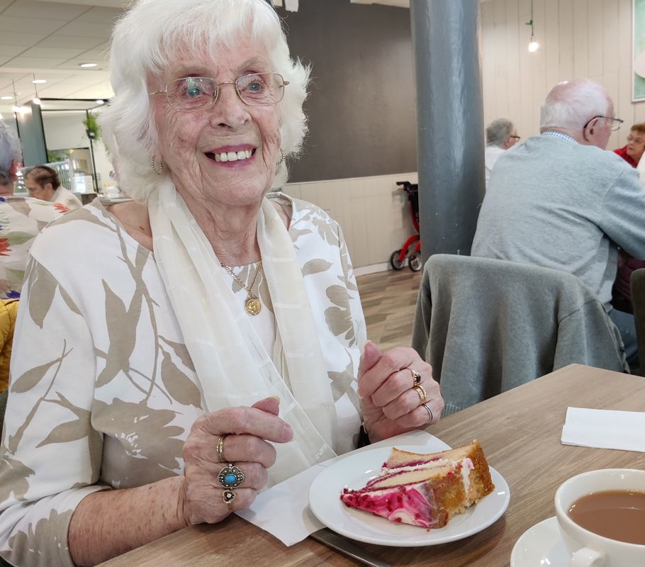 home care client enjoying cake