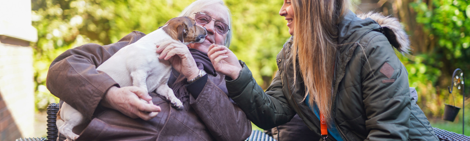 CareGiver with male client and pet dog