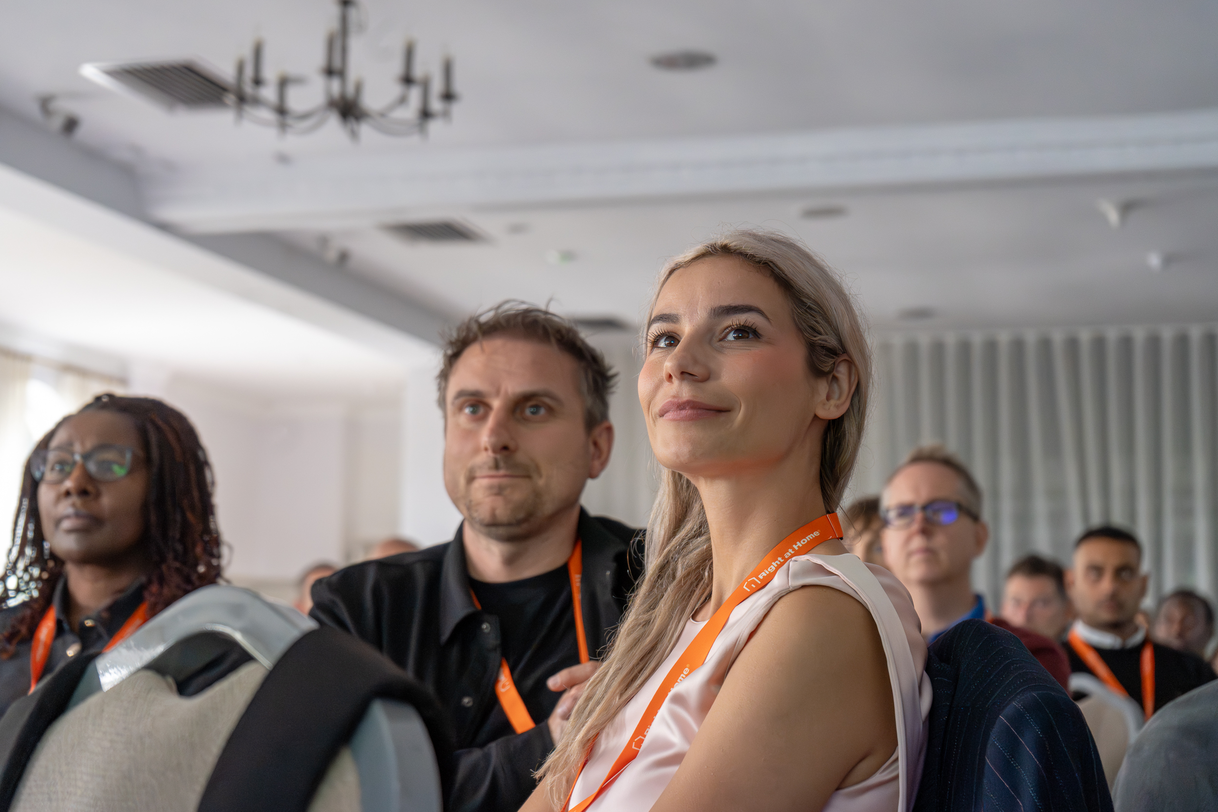 franchise owners watch talks at annual conference