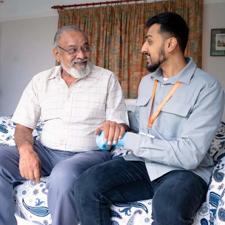 Client and Carer conversing following medication delivery through IV