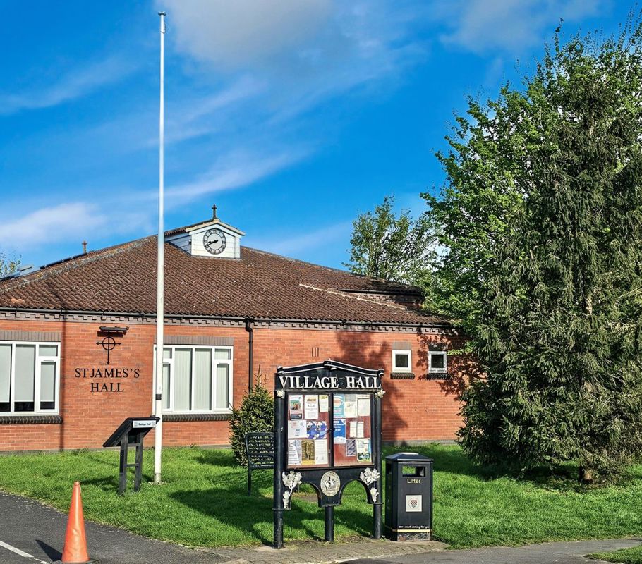 village hall sign and trees in long bennington