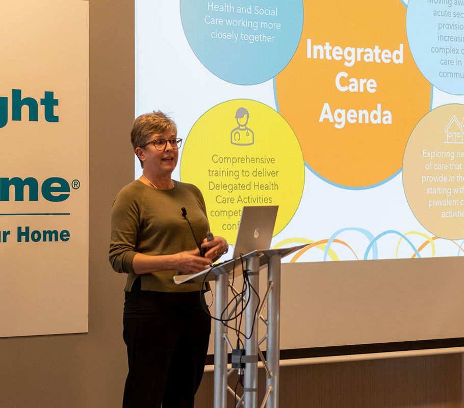 lisa delivering a talk on clinical care