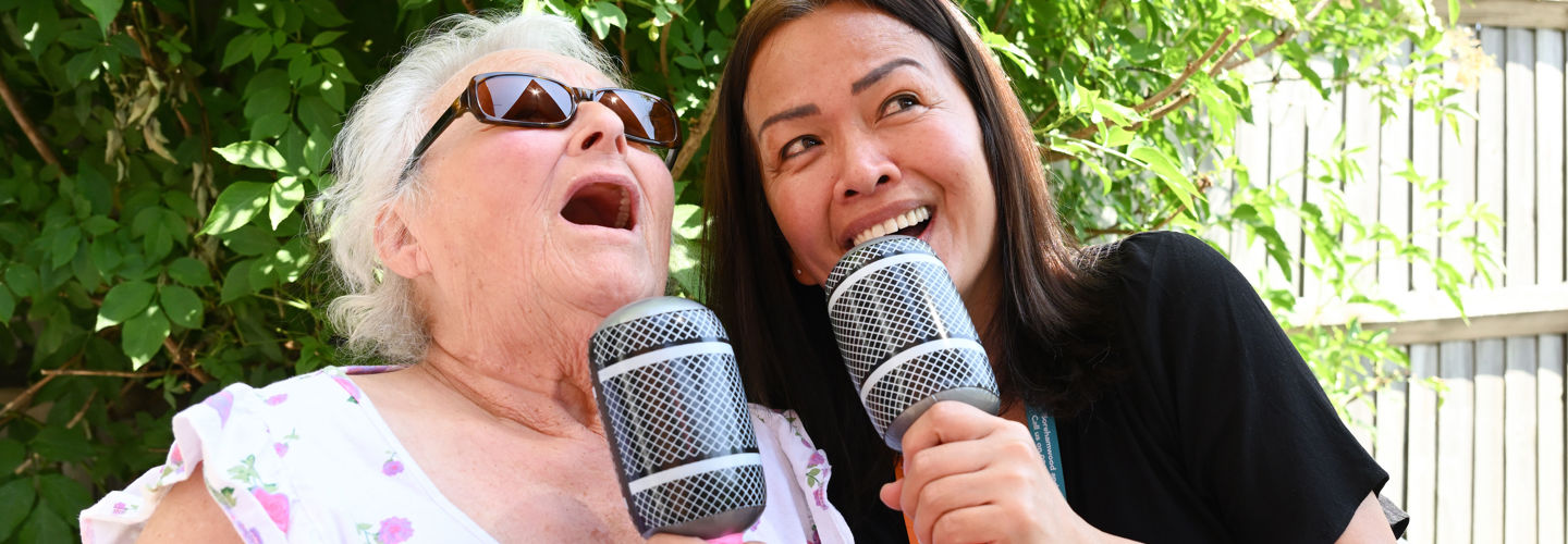 Companion_CareGiver_Singing_With_Client_Outside_Garden