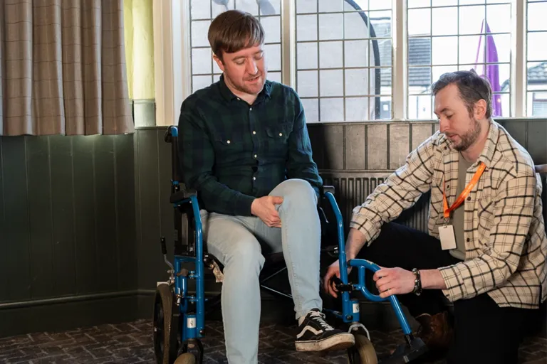 Carer and Client enjoying a day out at the local open mic night