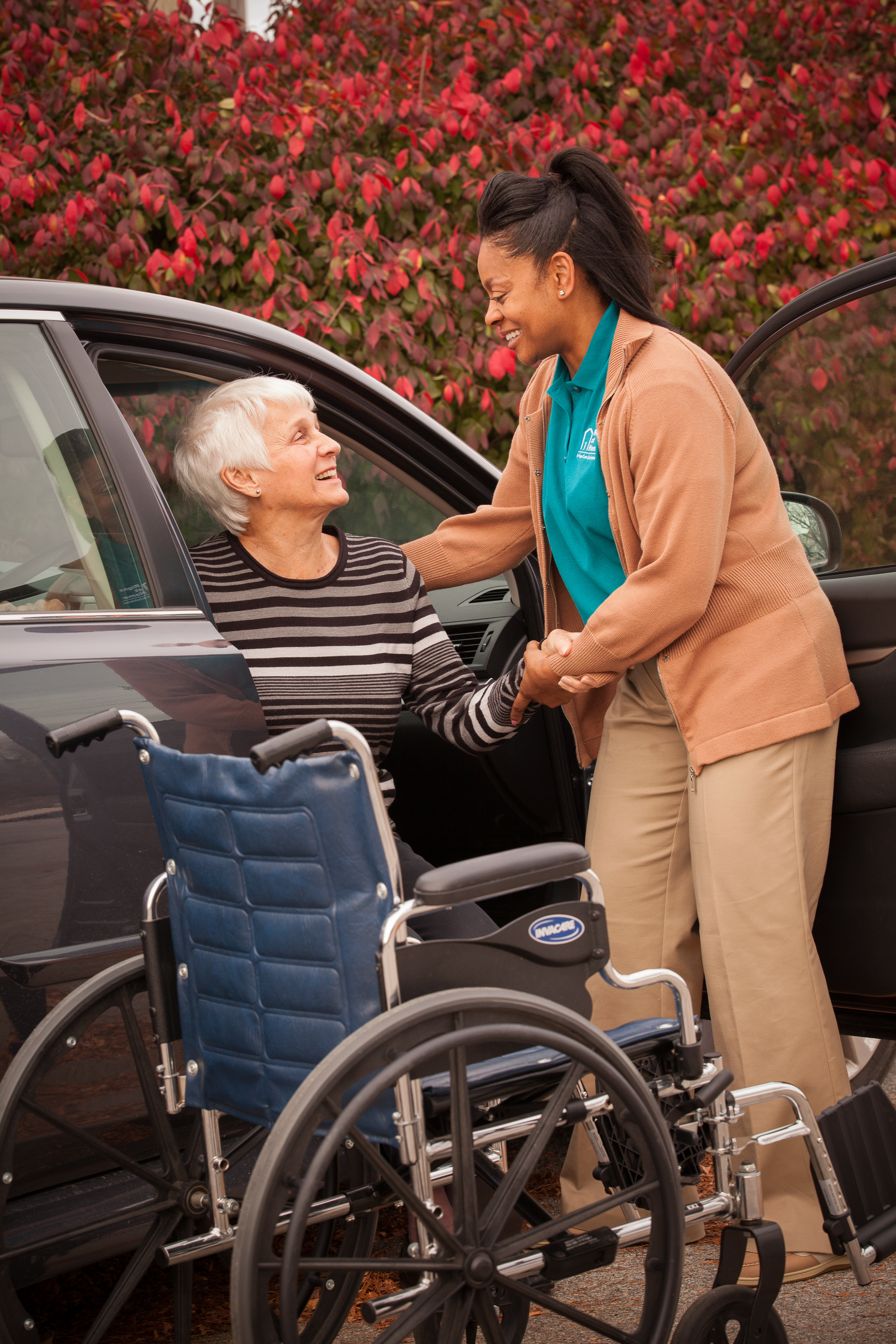 Caregiver Helping Client Out Of Car