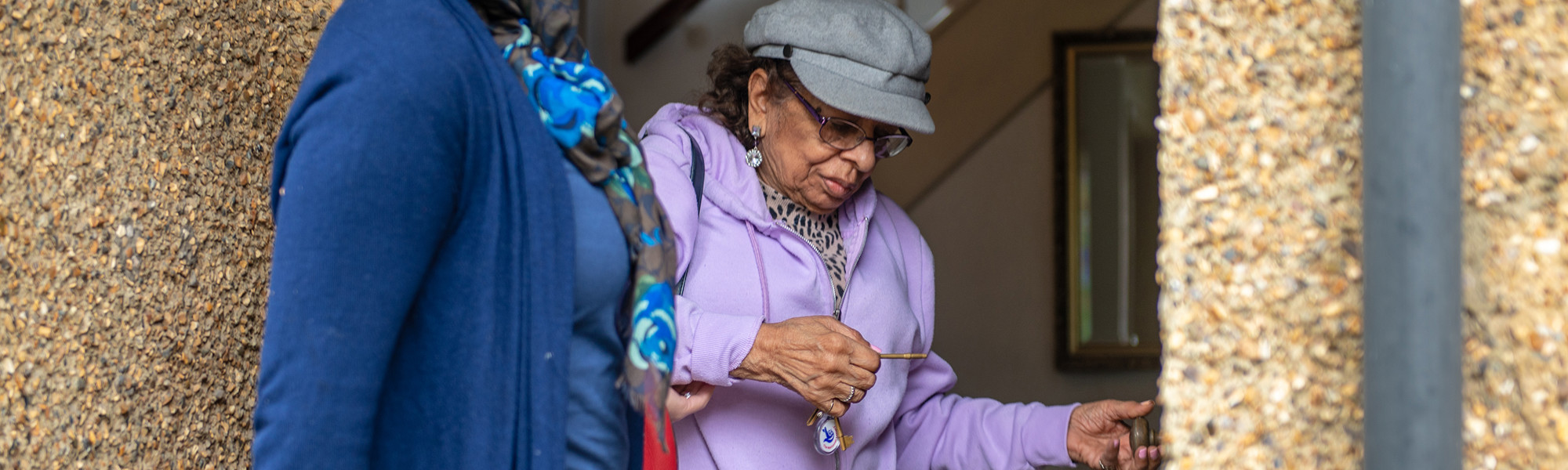 Client with CareGiver closing front door