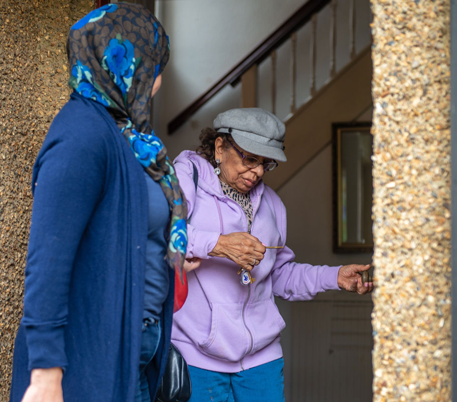 Client with CareGiver closing front door