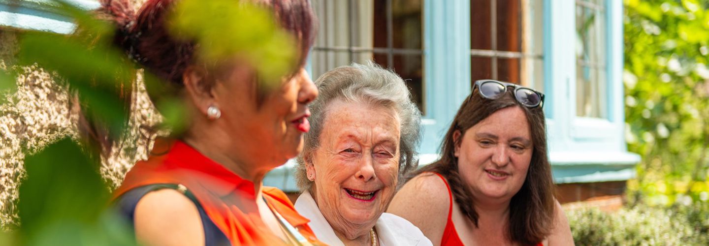 CareGivers on bench with Client