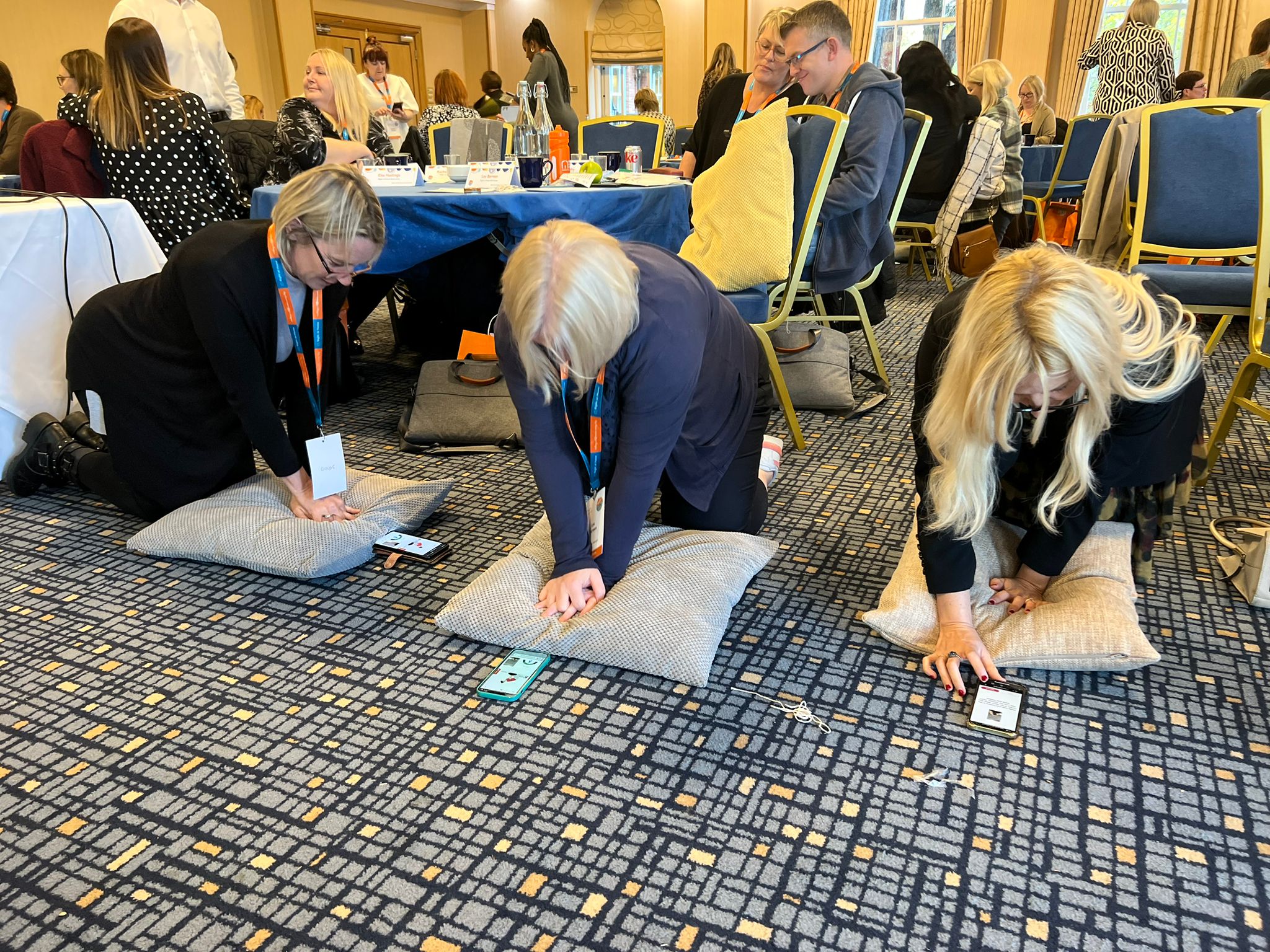 Practising CPR with the RevivR App and pillows